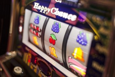 Golden Toad slot game on mobile phone showing five reels with Asian symbols